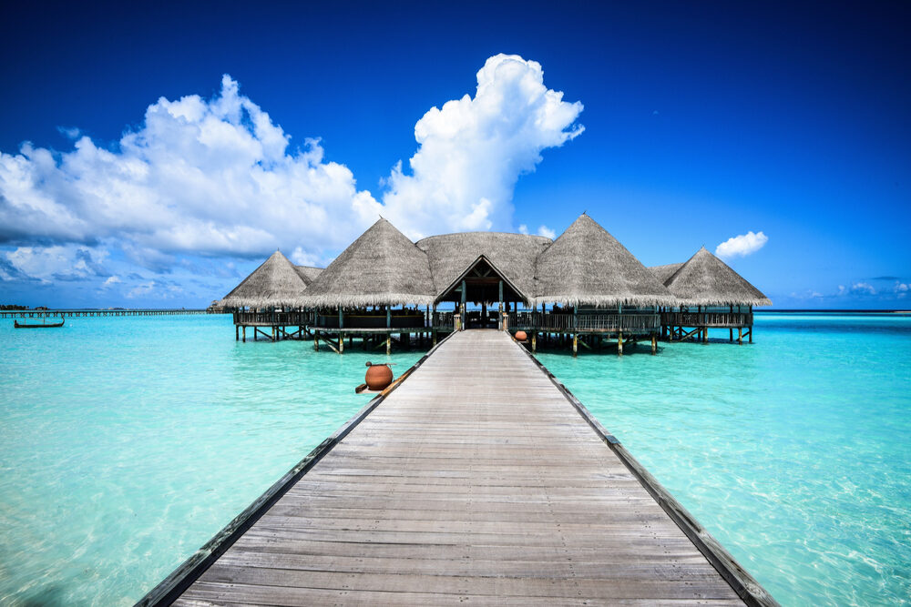Beautiful beach landscape with overwater bungalows Gili Lankanfushi in the Maldives
