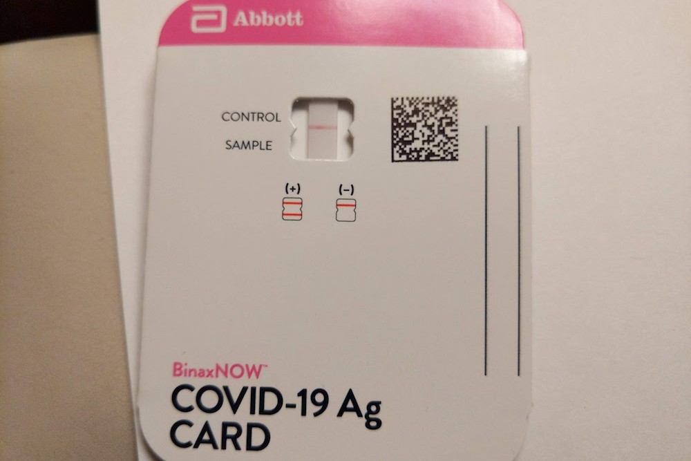 negative result of a rapid antigen covid test from self-adminisered eMed Abbot Binax covid testing kit