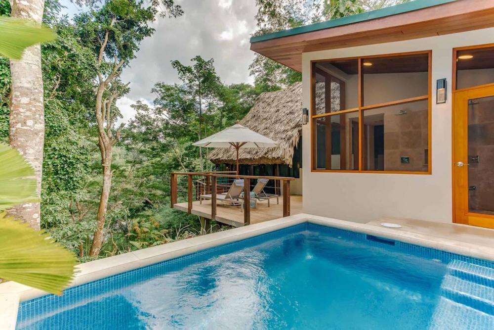 A treetop villa with outdoor plunge pool at Chaa Creek Lodge in Belize.