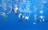 underwater photo of family snorkeling in Mexico