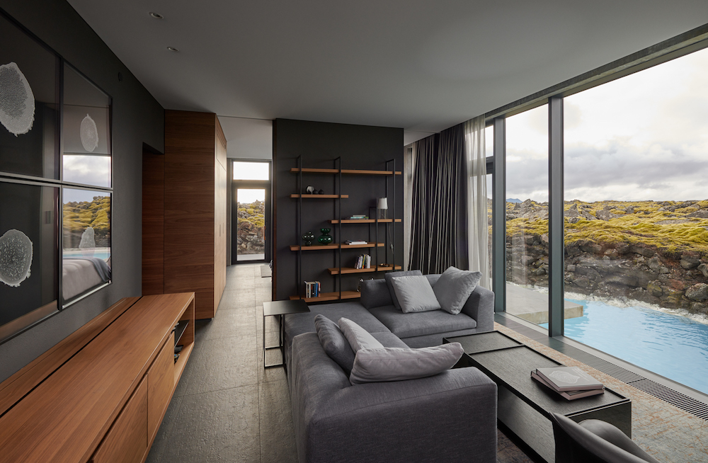 A suite at the Retreat at The Blue Lagoon in Iceland overlooking the water and the mossy land