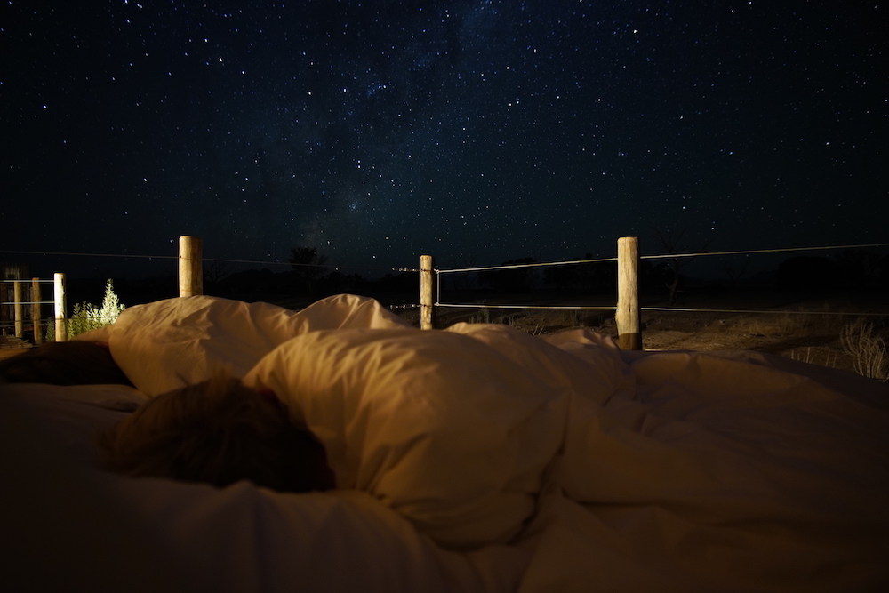 Stargazing from bed at Little Kulala 