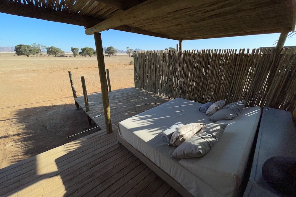 The outdoor bed by day Little Kulala resort Namibia