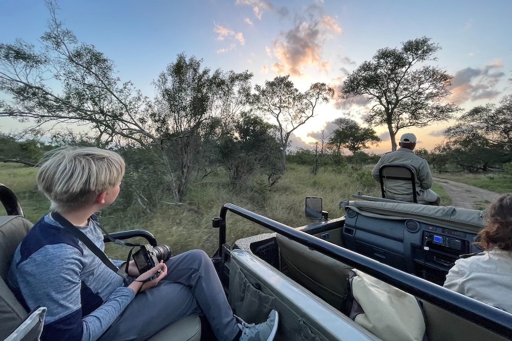 Our safari vehicle at Sabi Sabi: no sides or top, with our ranger at the wheel and our tracker up front. South Africa