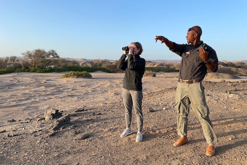 tourist woman and guide on safari in South Africa