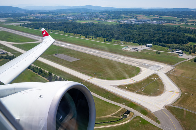 view of zurich airport runway from plane window