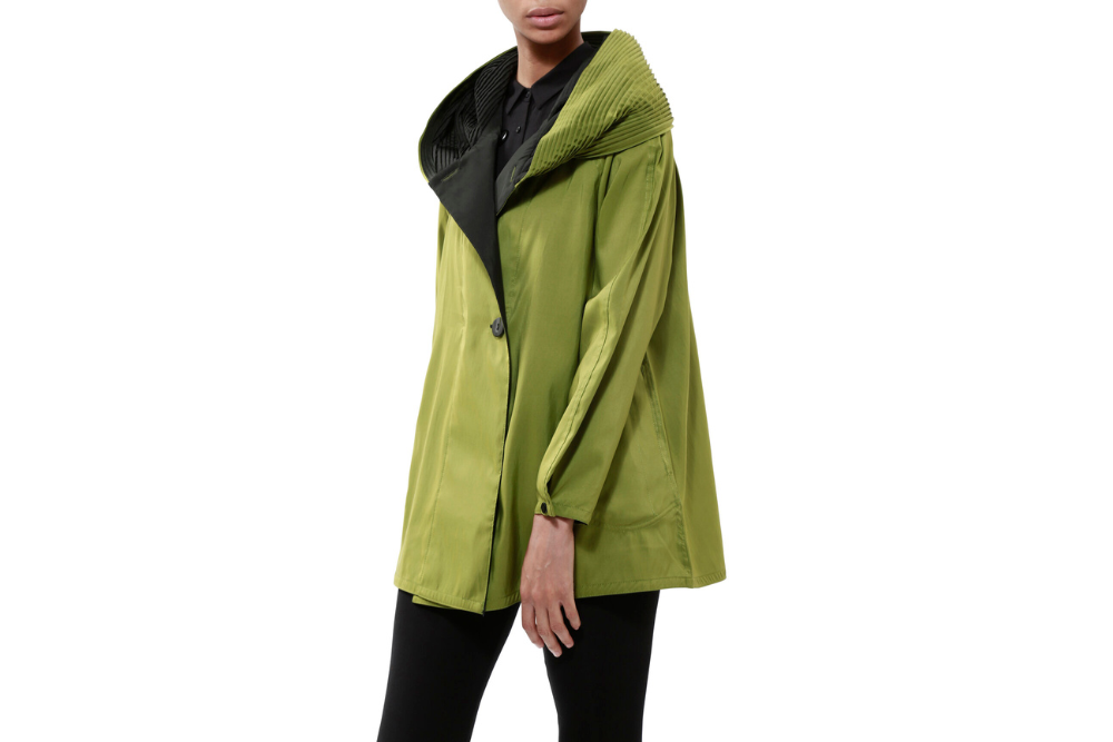 Photo of a green reversible coat worn by a woman