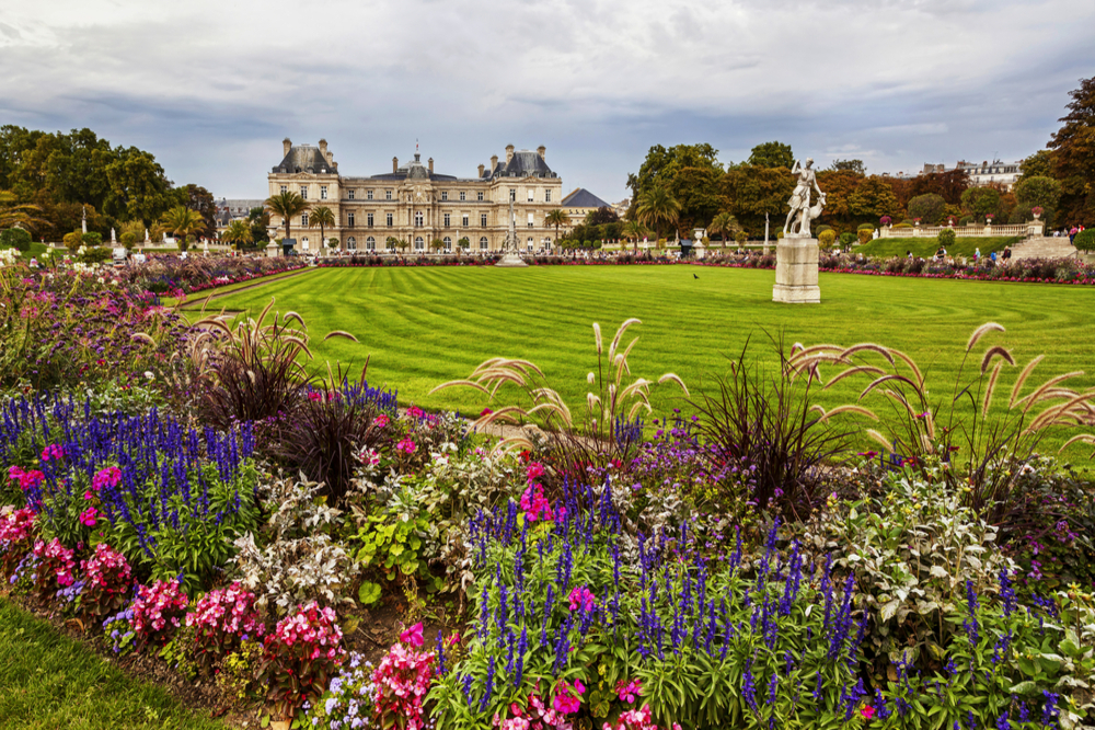 Luxemburg Palace and garden full of flowers in Paris.