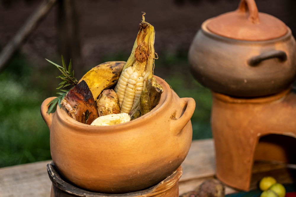 A traditional Peruvian food cooked underground and stones.