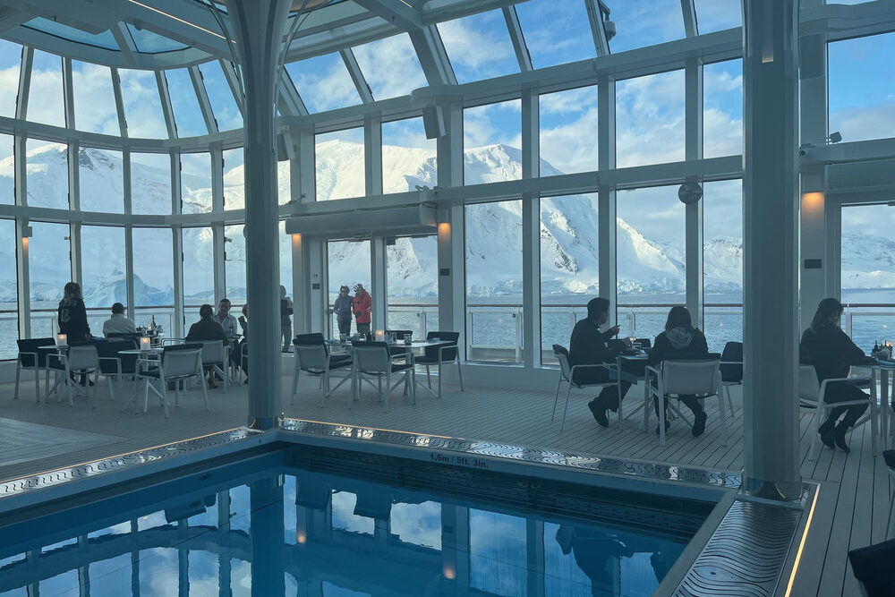View of Antarctica through the glassed-in walls inside the cafe/swimming pool while dining.