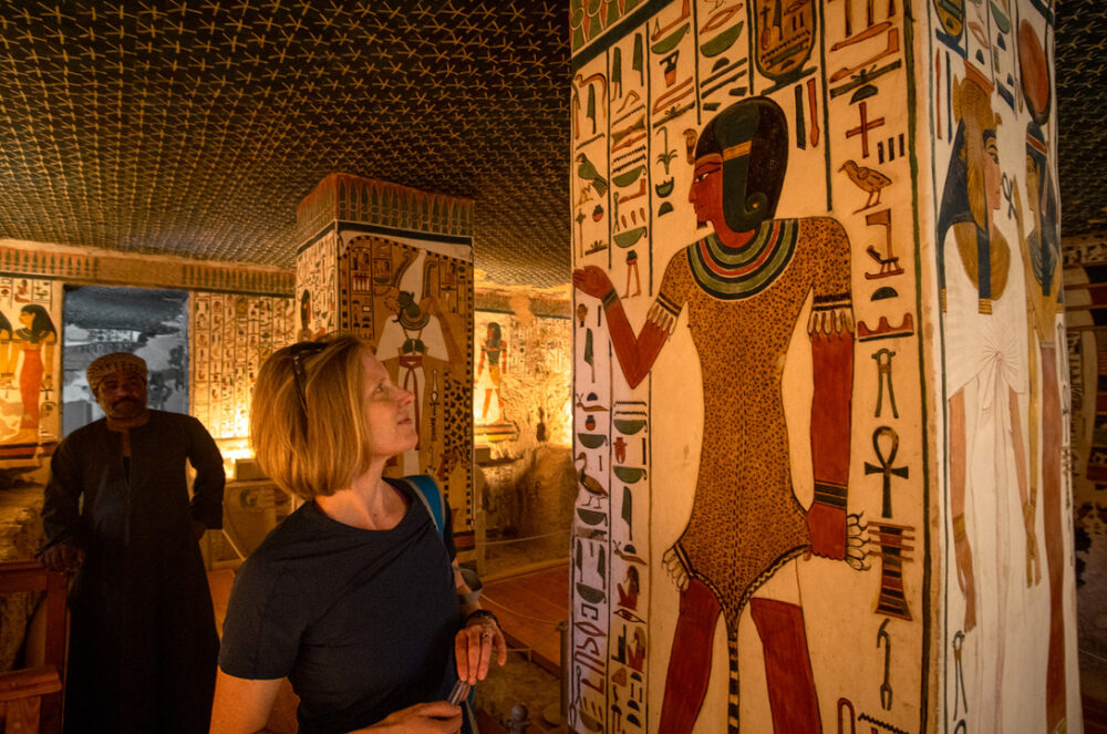 Brook looking at the mural painting inside Nefertari's Tomb.