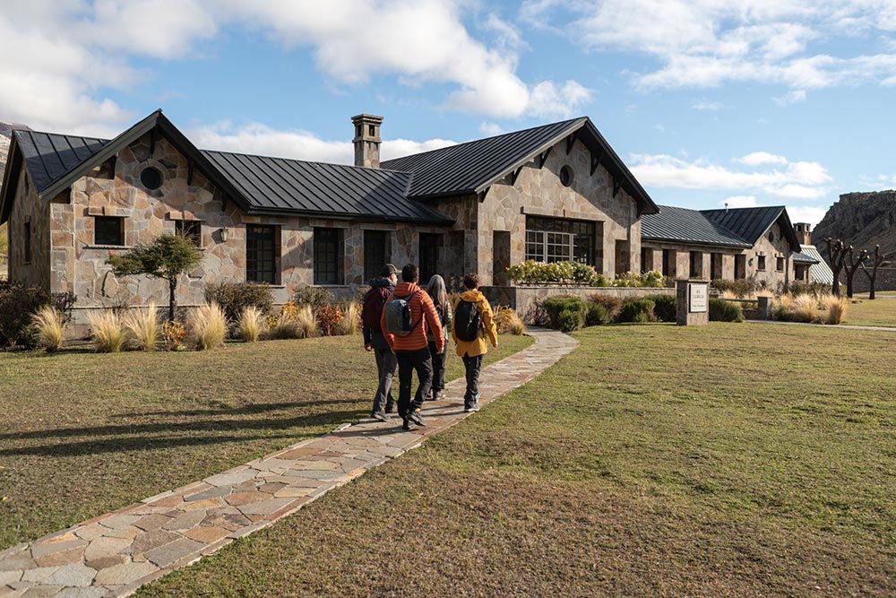 People walking towards the Explora Lodge in Parque, Patagonia.