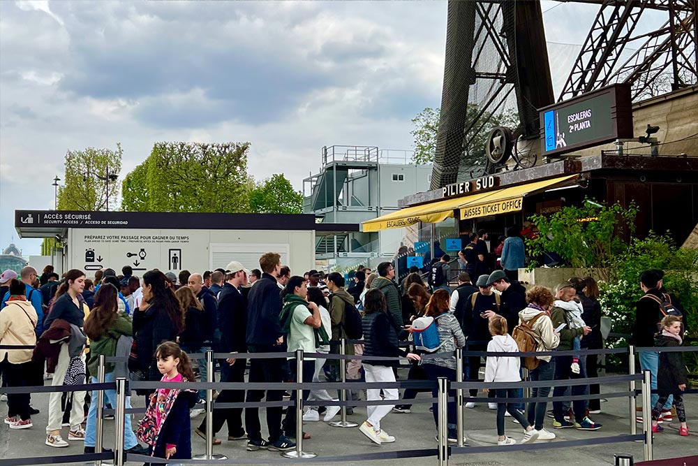 A line of people waiting to buy stairs tickers for the Eiffel Tower