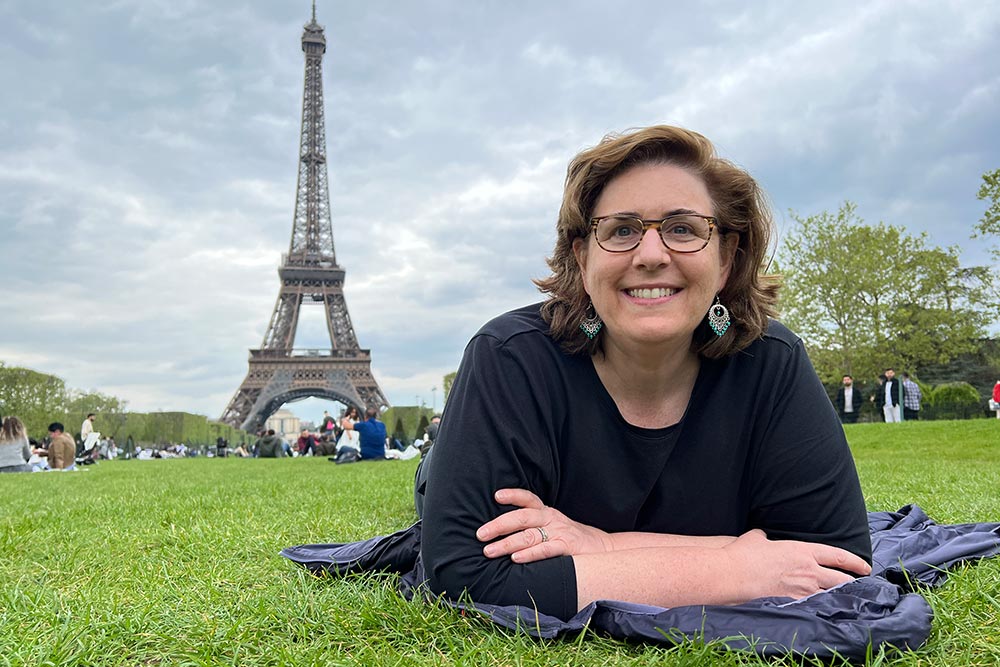 Wendy-Perrin on Champ de Mars with the Eiffel Tower in the back.