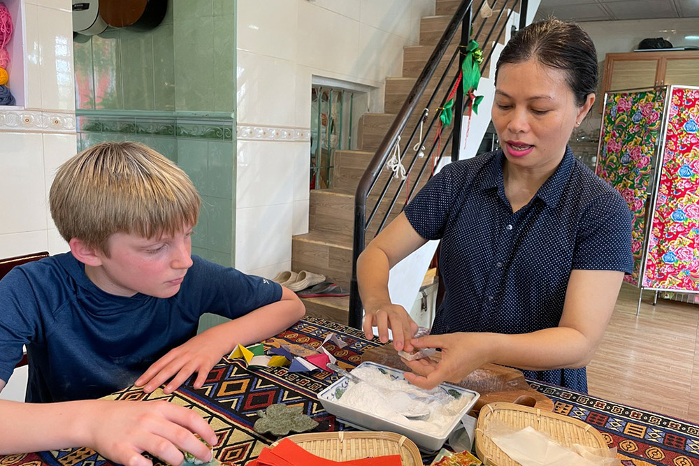 Zeke making candies with another women.