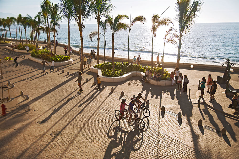 Boardwalk with people in Puerto Vallarta Malecon.