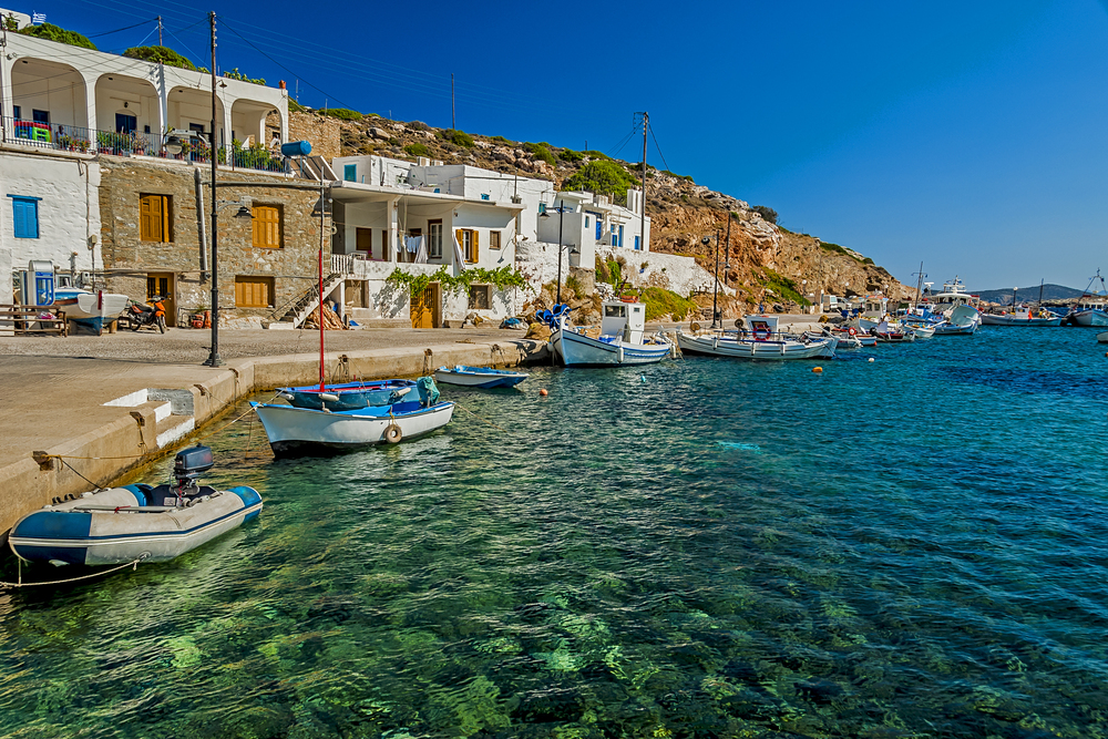 Authentic buildings and clear water beach in Sifnos island in Greece.