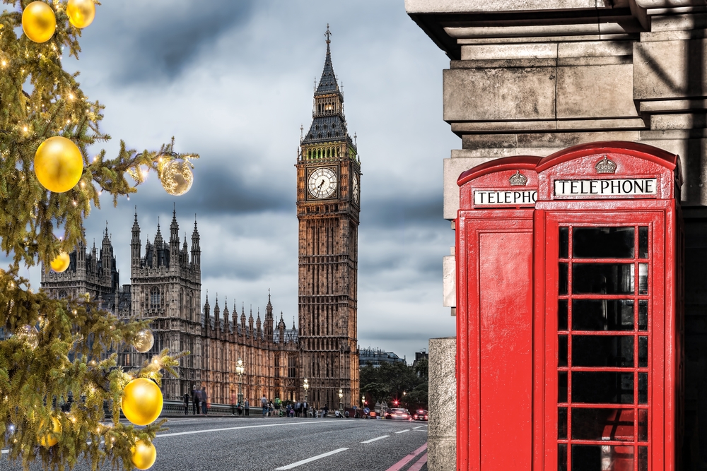 Big Ben clock and the red telephone booth during Christmas time in London, England. 