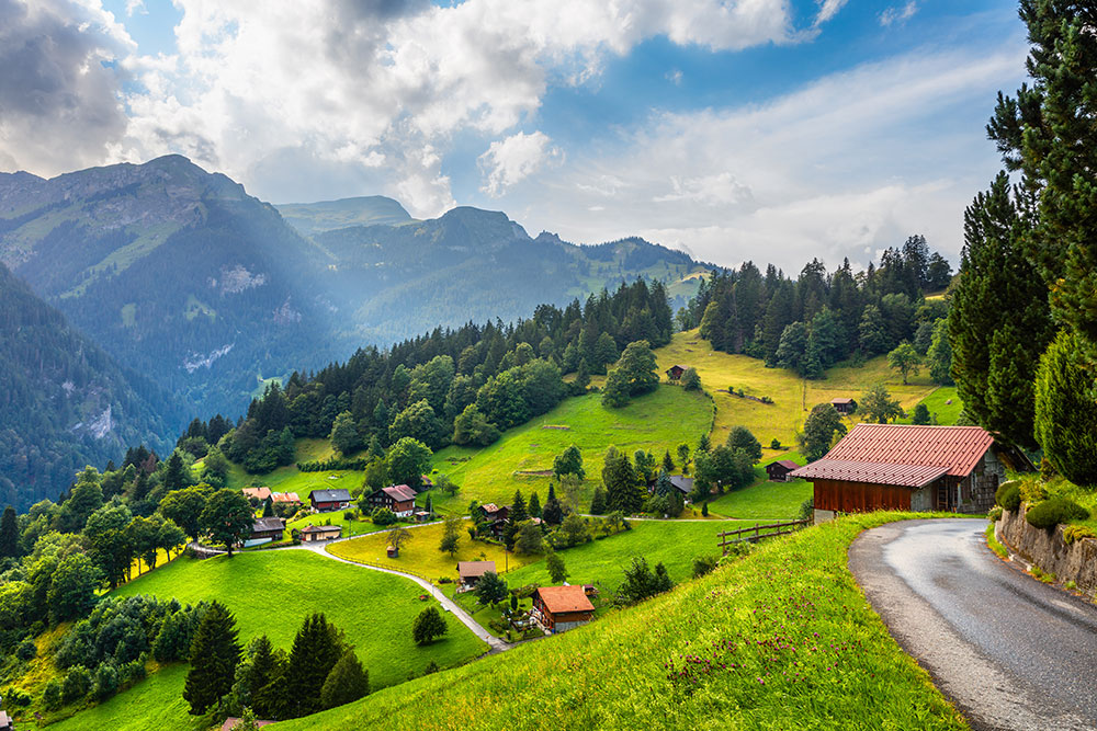 Wengen village with the Swiss Alps in the background.