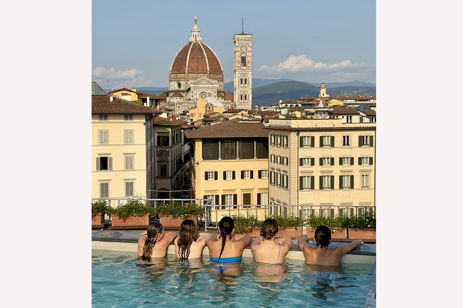 Andrea's family enjoying the view of Florence from the rooftop pool.