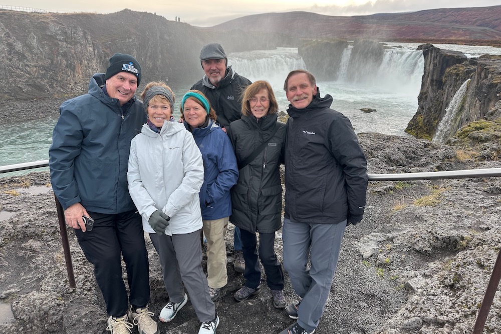 Travelers at Go∂afoss Waterfall in northern Iceland.