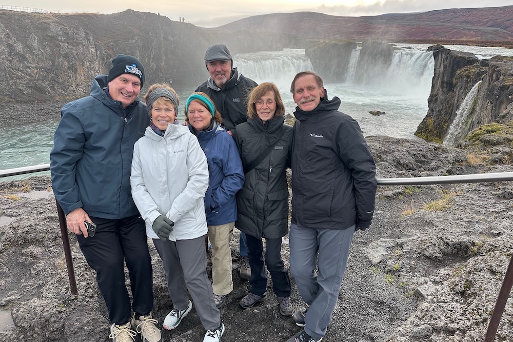 Travelers at Go∂afoss Waterfall in northern Iceland. 