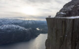 Brook and family at Pulpit Rock above Lysefjord with showy mountains in the background.