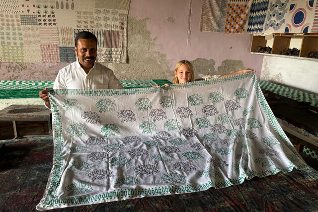 One of the travelers and the private guide at a block-printing workshop in India.