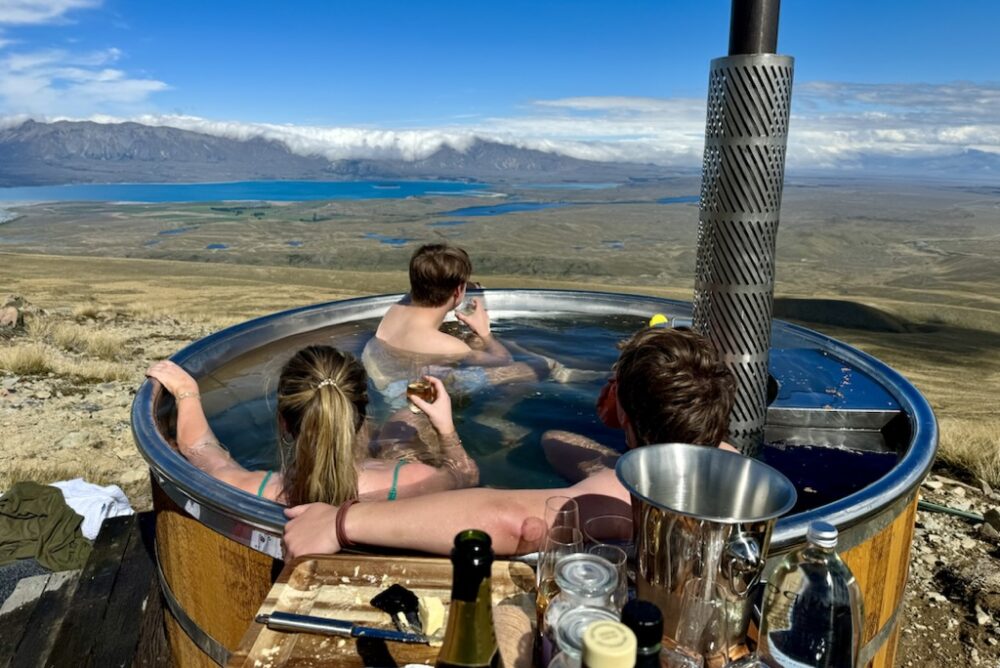 The Hancock's children in the remote hot tub in the mountains on New Zealand's South Island.