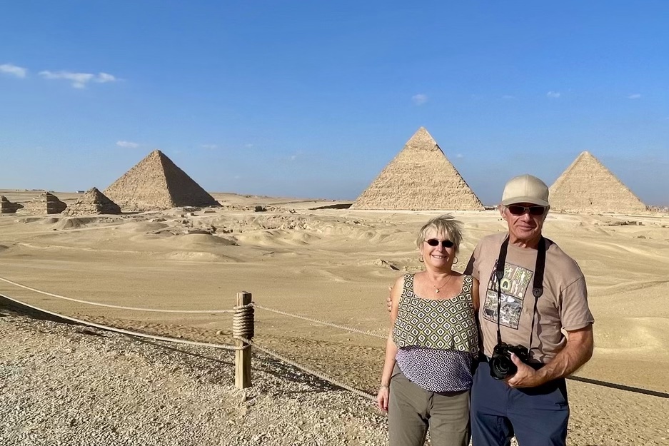 Travelers at the pyramids of Giza all by themselves.