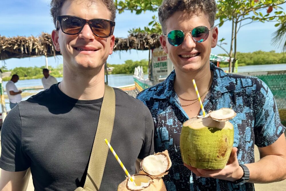 Lynn Herrick's sons enjoy fresh coconuts.