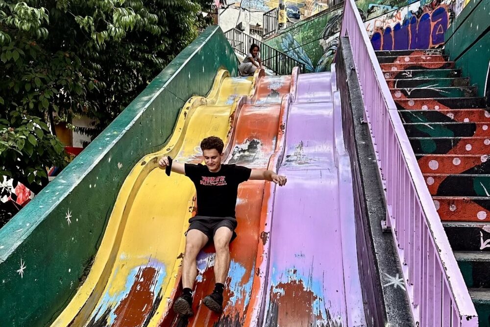 Sliding in Medellin's hilly Comuna 13 neighborhood.