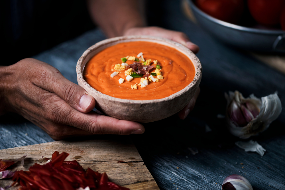 Spanish salmorejo, the traditional dish of Cordoba is a cold tomato soup topped with serrano ham, boiled egg and green pepper.