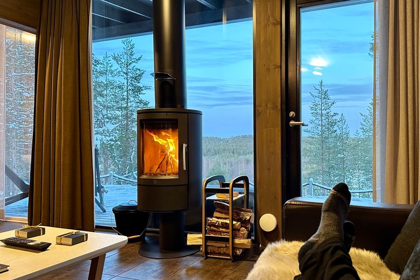 The cozy and warm Glass House Suite at the Arctic Treehouse Hotel in Finland.