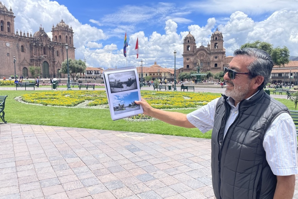 Teo Allain Chambi at Plaza de Armas in Cusco showing photos of from the Plaza.
