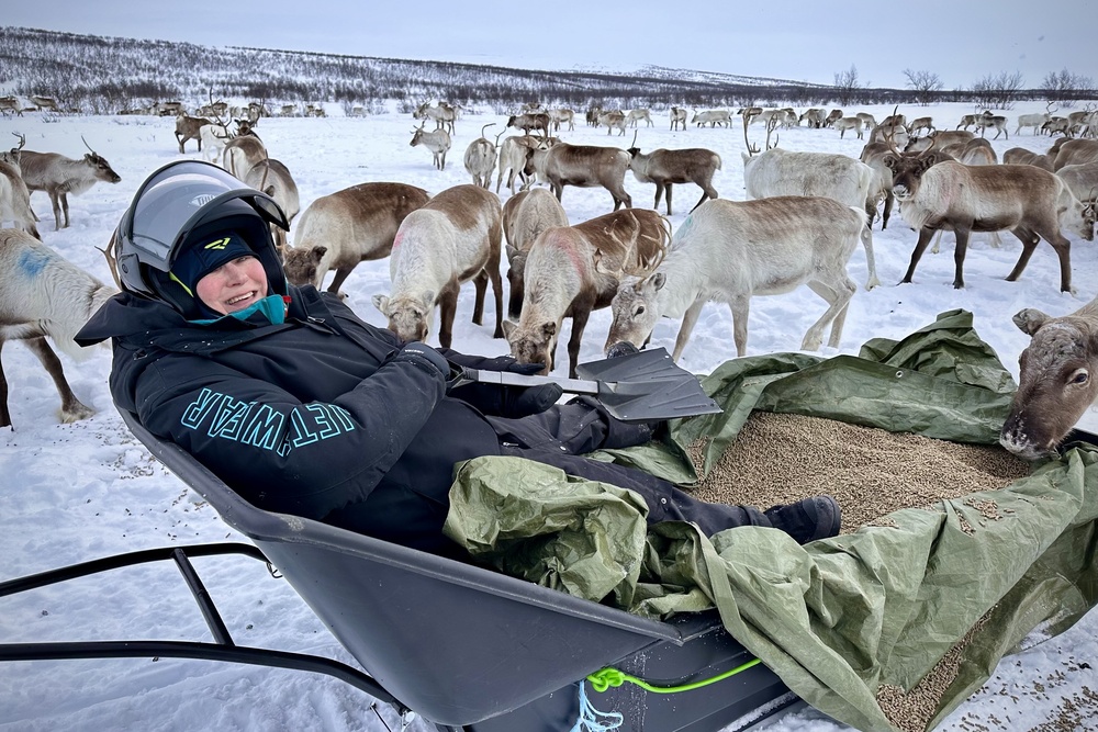Traveler Julie Silbermann feeding reindeer in Norway.