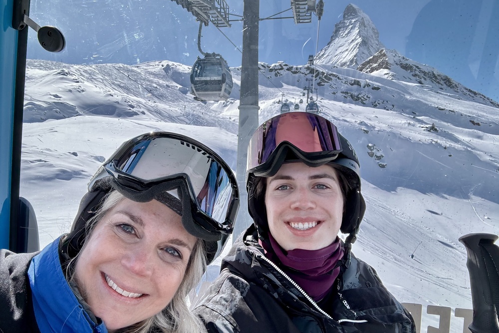 Traveler Wendy Mueller and son Evan riding the gondola with the Matterhorn in the background on the Swiss Side of Zermatt, Switzerland.