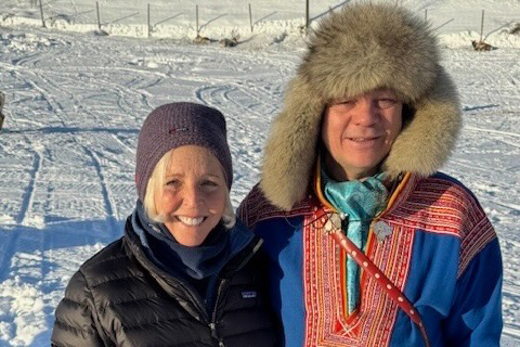 Traveler Kathye Faries with a Sami reindeer herder, in the village of Maze, Norway.