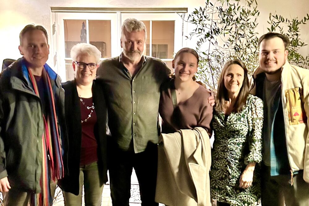 Cari Bender and her family with the dinner's local hosts in Copenhagen, Denmark.