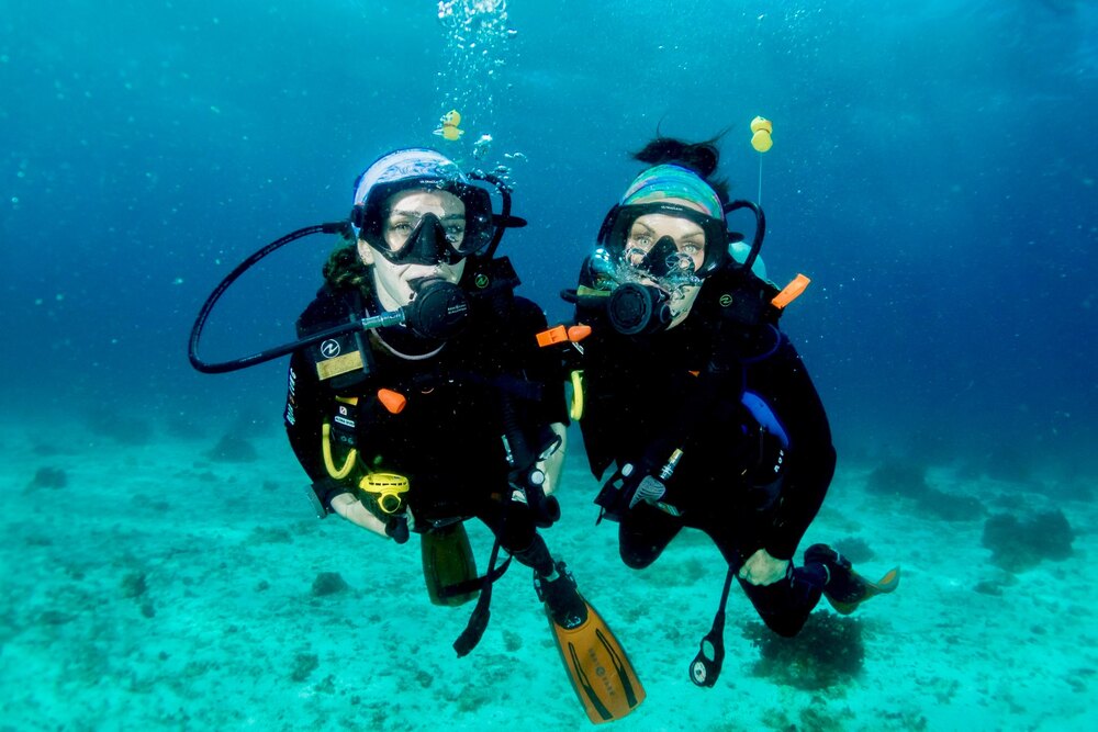 Traveler Andrea Phillips and daughter Rachel underwater, diving off Balicasag Island, Bohol, Philippines.
