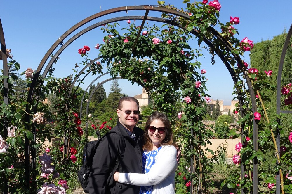 Travelers JoEllen and her husband in the gardens of the Generalife palace estate in Spain.