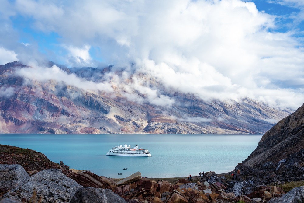 The Greg Mortimer ship sailing in Greenland.