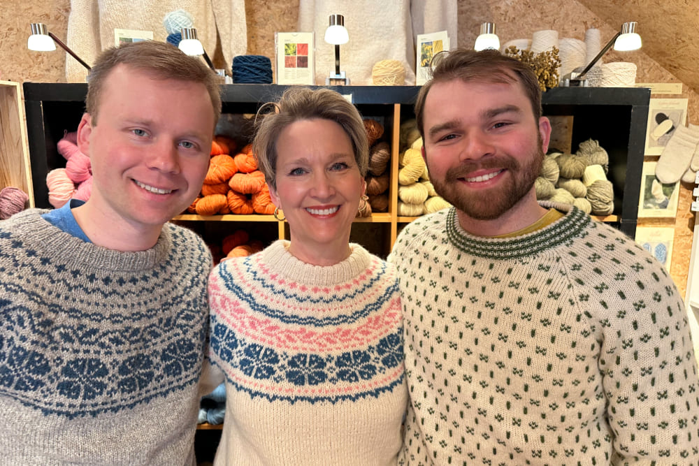 Christi LeClair and family wearing wool sweaters during a visit to Lofoten Wool Farm in Norway.
