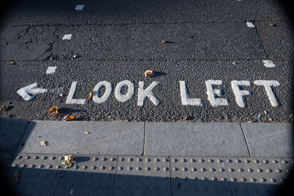 "Look Left" sign on a sidewalk in London, England.