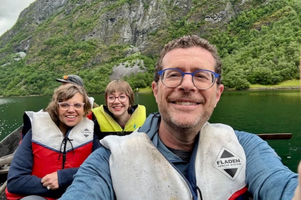 Jeremy, Marci and Mira Silverman crossing Nærøyfjord in a traditional Norwegian rowboat.