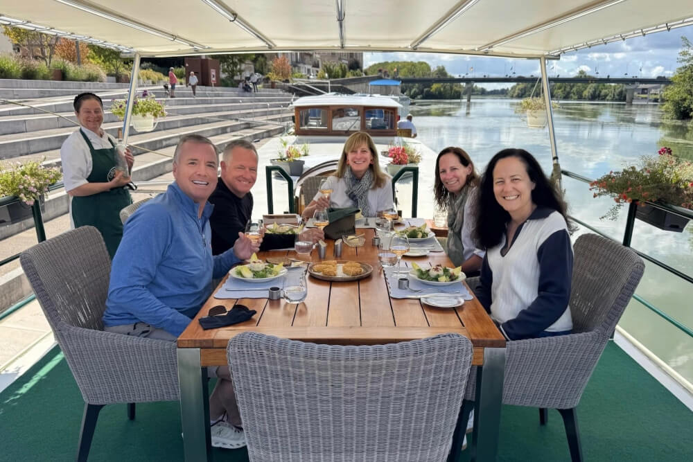 Jill Marget and her family having lunch on the deck of their barge in Burgundy, France.