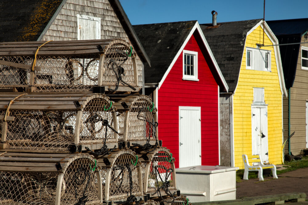 Lobster pot with oysters barns in the background, in New London, Prince Edward Island.