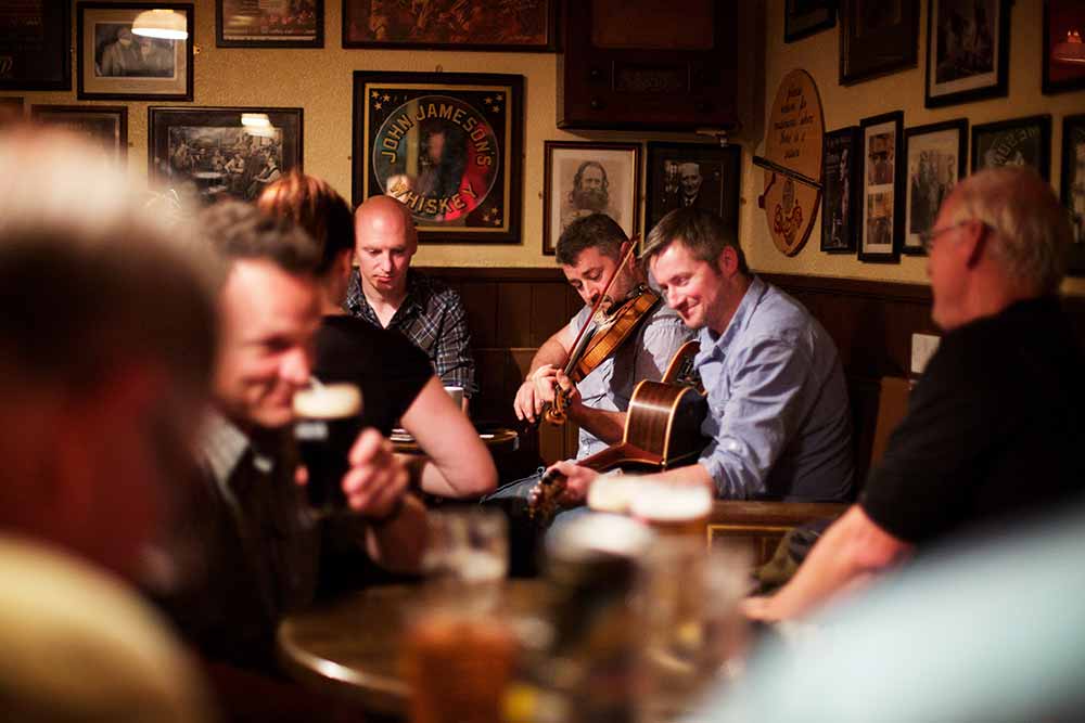 People playing traditional Irish music on a pub.