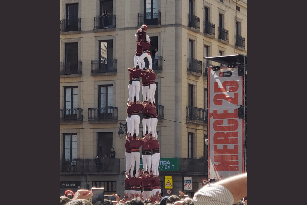 A human tower stands high above the Fiesta de la Merce, Barcelona street festival.