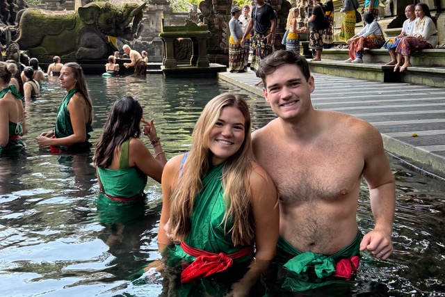 Madison and Brent Wooley during a purification ceremony in Bali, Indonesia.
